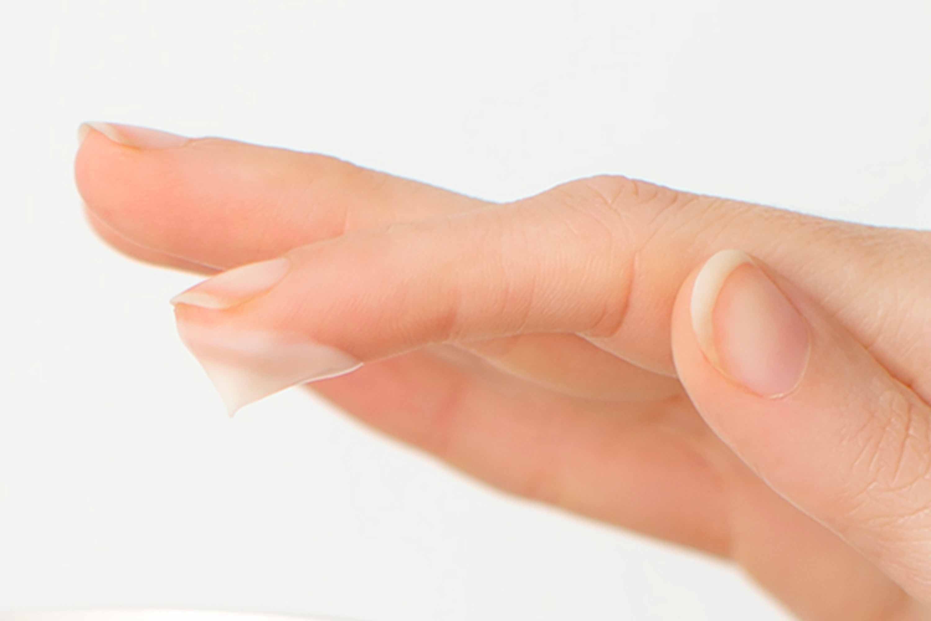 Grapey natural cream on a fingertip