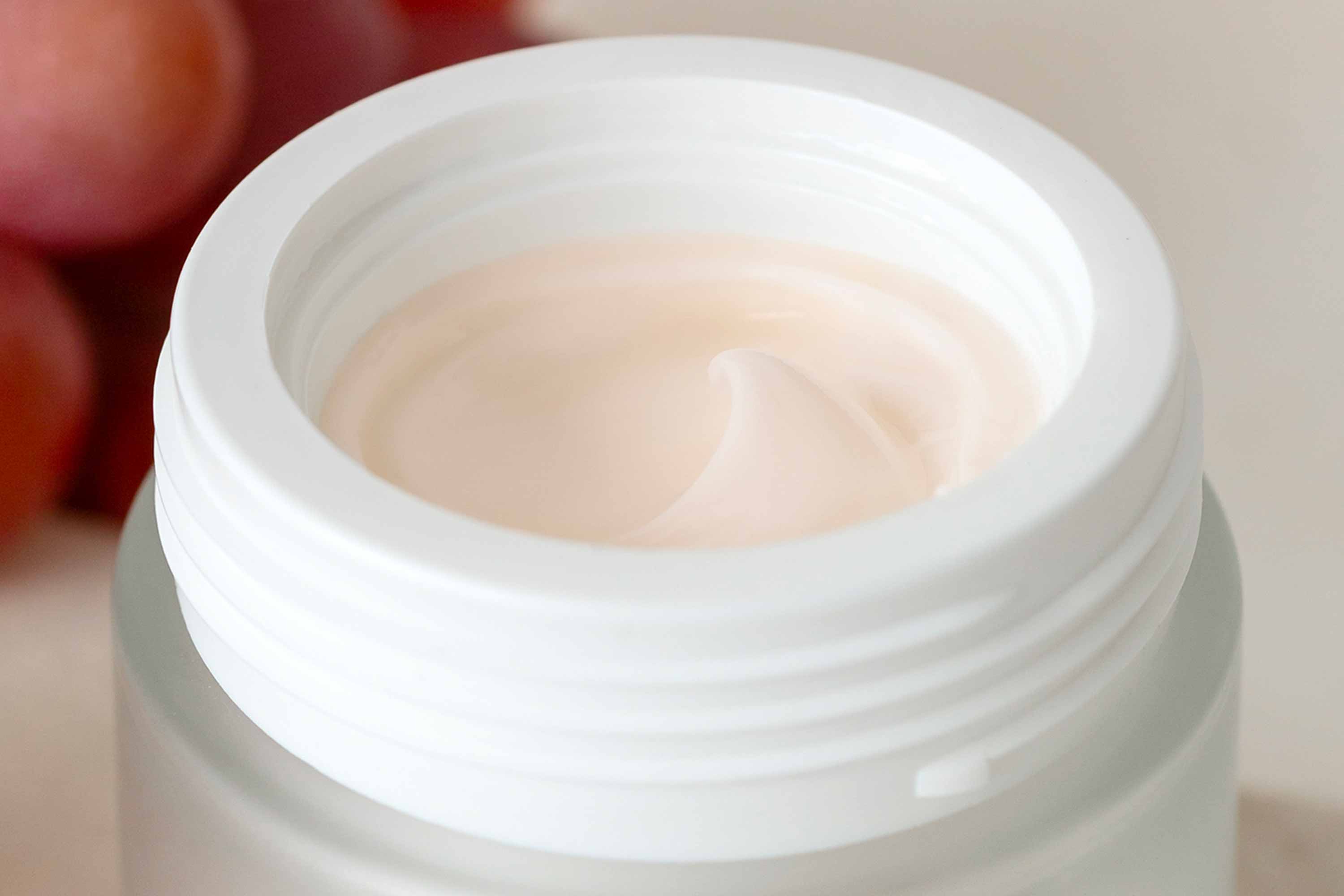 Texture and color of natural face cream made with grapes